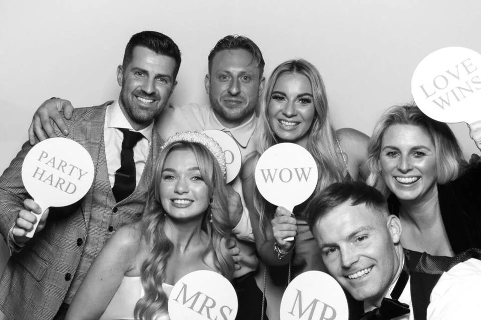 Guests posing at the photo booth